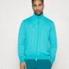 Nike Performance Heritage - Training Jacket - Teal -Fashion Shop 98149e1d031246e0bfd9ed0f145741c9